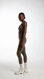 Origin Leggings in olive styled for Pilates and everyday movement with gentle sculpting support.