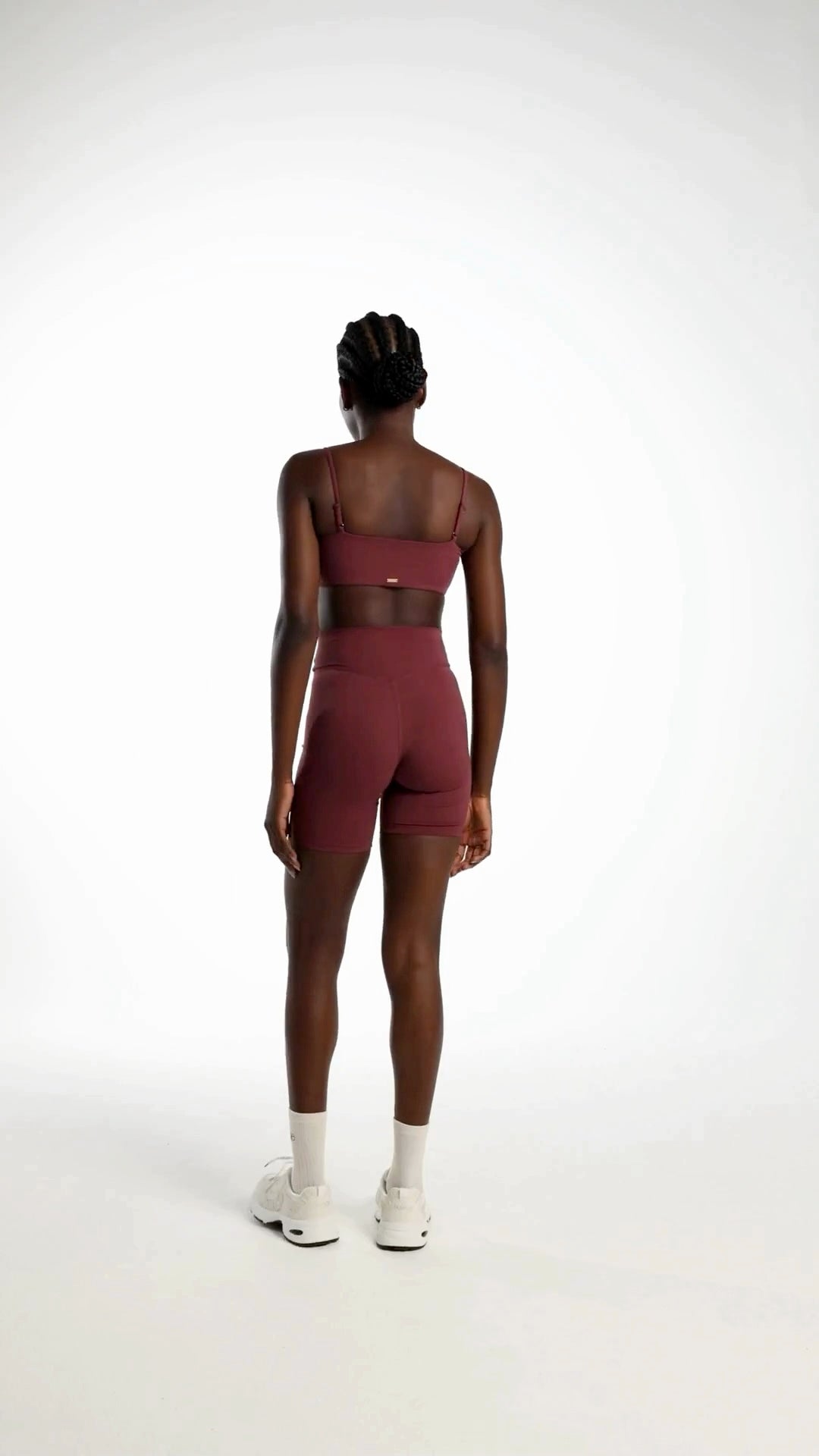 Model wearing fig Origin Shorts designed for Pilates, yoga and everyday movement.