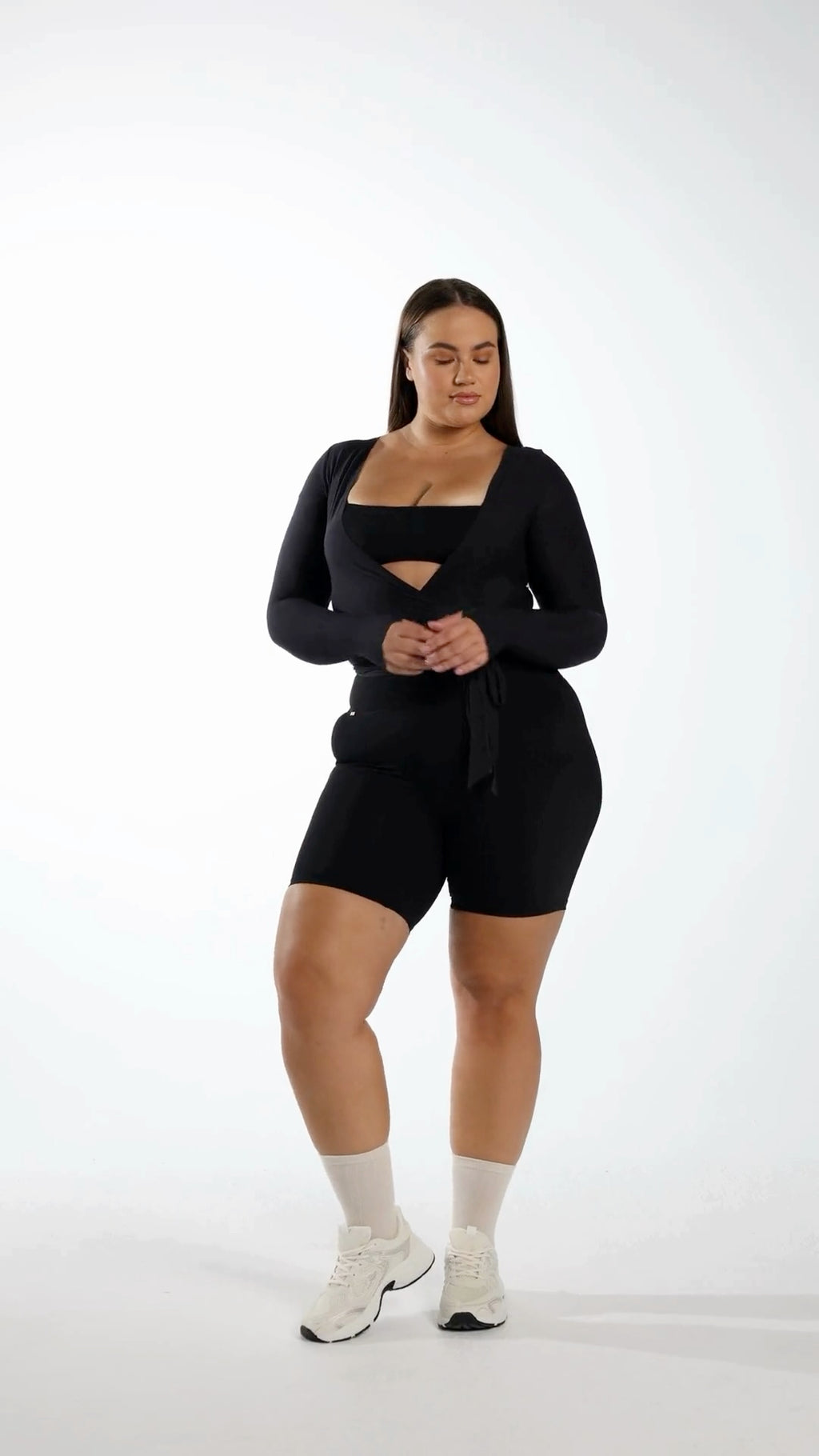 Origin Shorts in onyx worn during studio training, highlighting compressive GLIDE fabric fit.