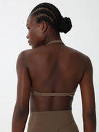 Origin Twist-Front Halter Bra in olive styled for Pilates and low-impact training